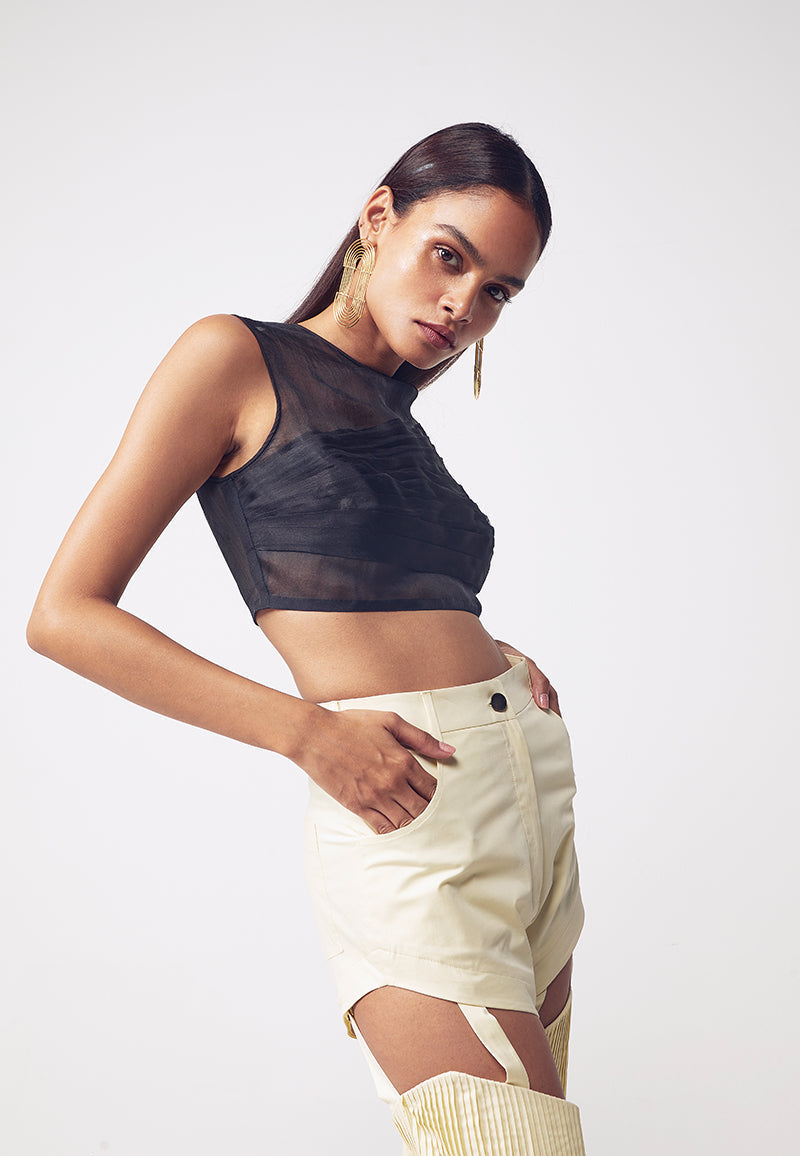 Level up your style with these buttercream combat-inspired straight, detachable pants crafted in cotton twill which make the pants smooth and comfortable. These pale yellow pants sit high on the waist and fall straight to the floor. These pleated straight pants can be transformed to a pair of shorts by using the buttons hidden around the thigh for detachable function. Pair these cut-out pants with a crop top