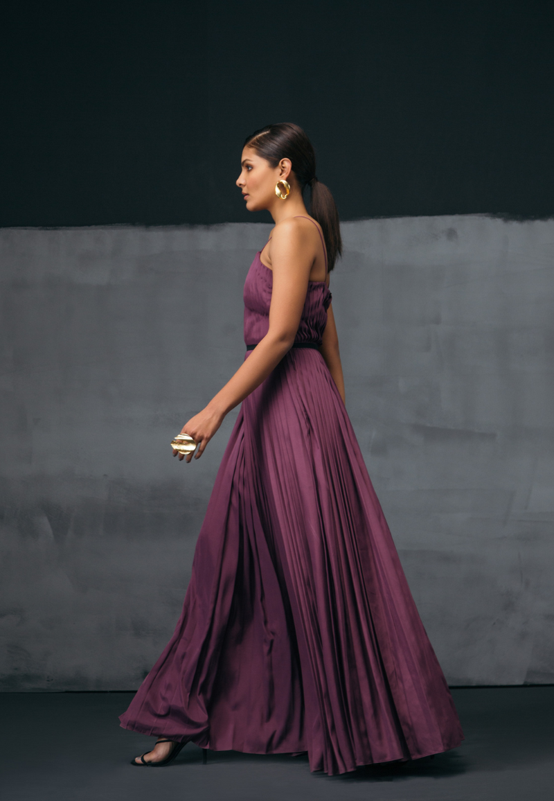 Balance and proportion define Mannat Gupta's signature silhouettes, Ready for a party look with our jumpsuit and playsuit collection, This sleeveless purple jumpsuit comes with a special hand-pleating effect. Feel free to style this jumpsuit set with a black waistband which adds more definition to a woman's body. This piece is perfect for all seasons and layering. Pair the look with hoop earrings and heeled sandals for your next dinner date or a girl's night out.