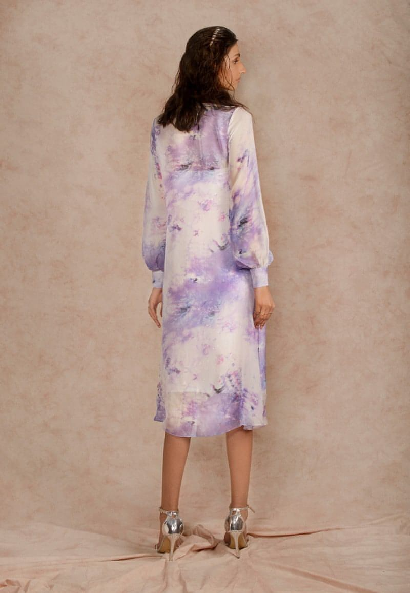 This purple and white sheer dye print midi dress with a sequin dress underneath can be styled in multiple ways. Made in chiffon and crepe this ensemble with handcrafted bandeau is perfect for the next date or formal evenings. Wear the piece in summer or style it in winter with an overlap jacket and stylish boots