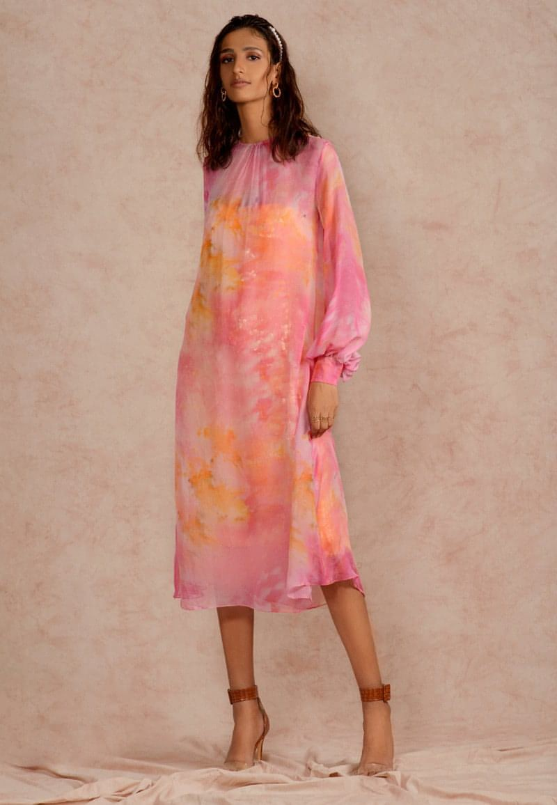 This pink and yellow sheer  dye print midi dress with a  sequin dress underneath can be styled in multiple ways. Made in chiffon and crepe this ensemble with handcrafted bandeau is perfect for the next date or formal evenings. Wear the piece in summer or style it in winter with an overlap jacket and stylish boots