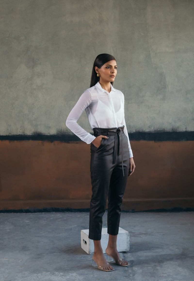 A classic white shirt is a great way to show off your personal style profile. Cut from wrinkled white chiffon, this minimal sheer white button down shirt is double layered and has long sleeves. Style it in summers or winters to work for a comfortable and elegant look.